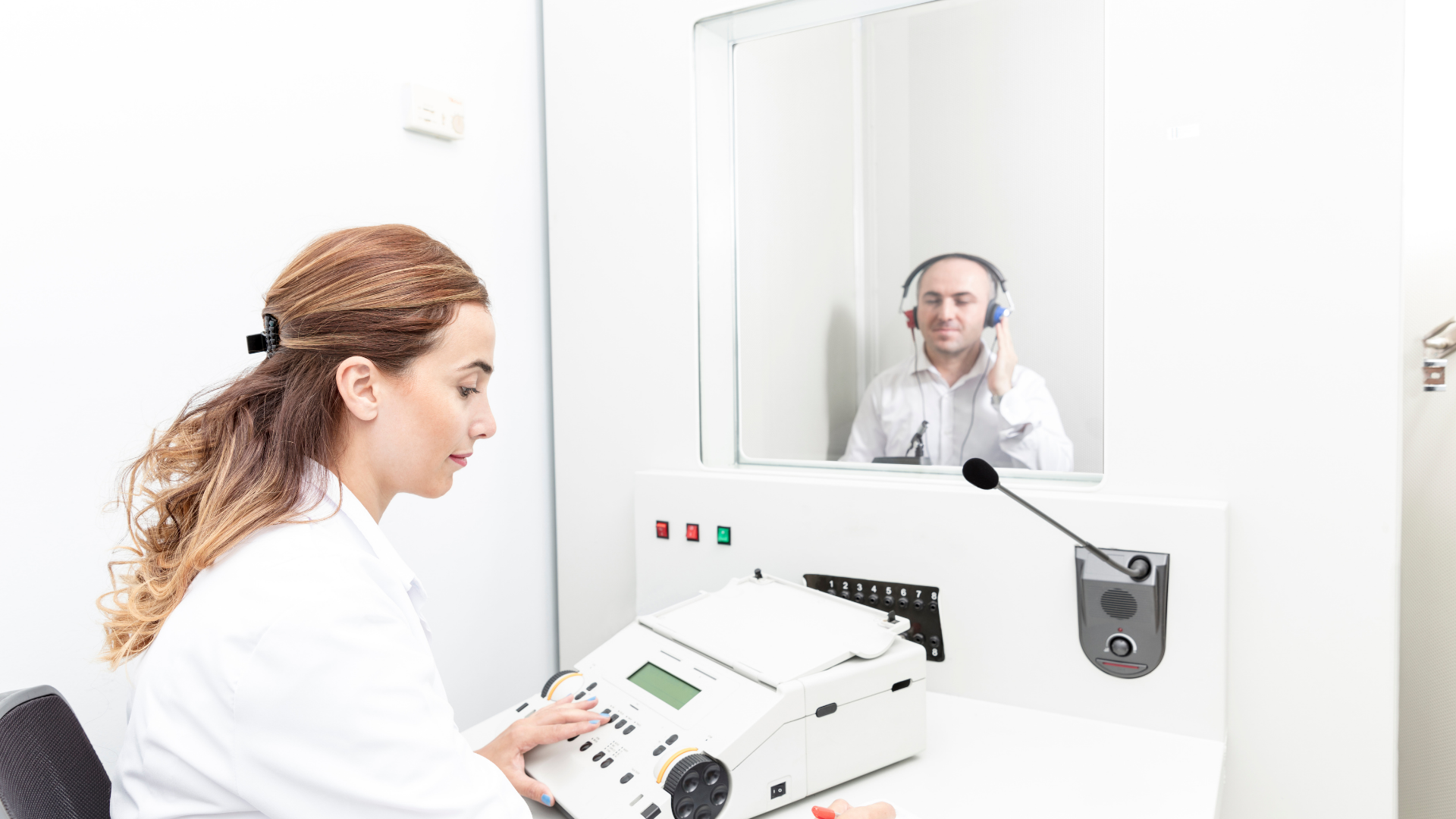 Audiologist undergoing a hearing test